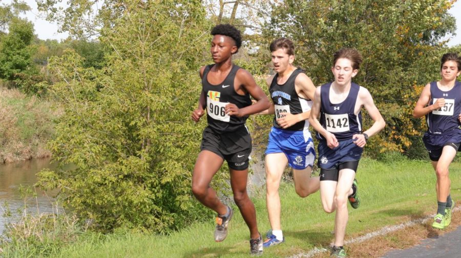 Sophomore+Kevin+Birge+%28right%29+runs+in+the+boys+open+race+at+an+Oct.+5+meet+at%0AYorkville+High+School.+The+team+competes+on+Saturday+Oct.+26+for+regionals+at%0AHammel+Forest+Preserve.