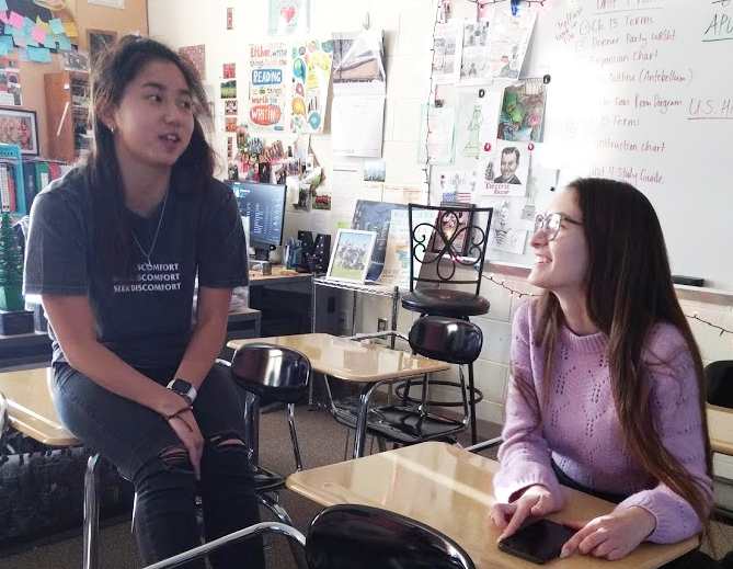 Natalie Hua, co-leader of Female Leadership Club (left), and Nadia Freitag, club member (right), discuss the club’s new t-shirts on
a Dec. 6 meeting. See teacher Erin McGinnis in room 120 for club information. The club will meet the week of Jan. 13.