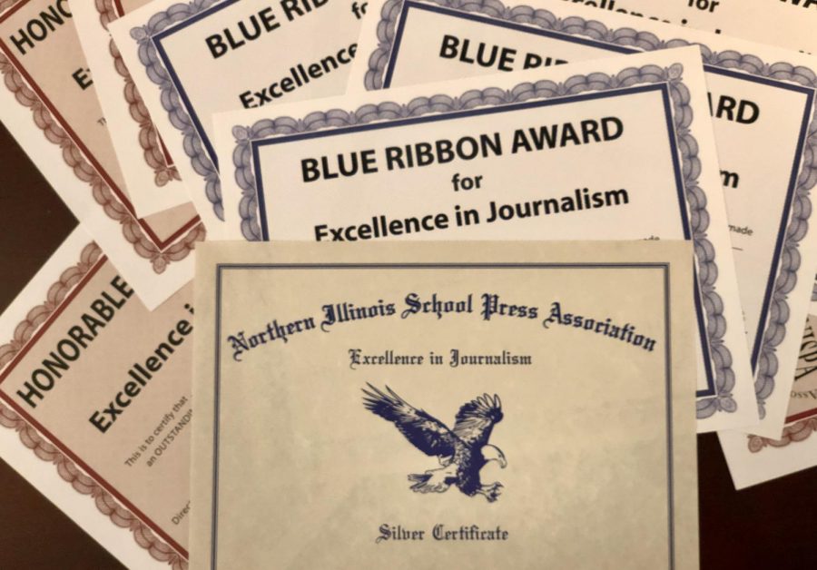 Award certificates pile high for East Side News members 
