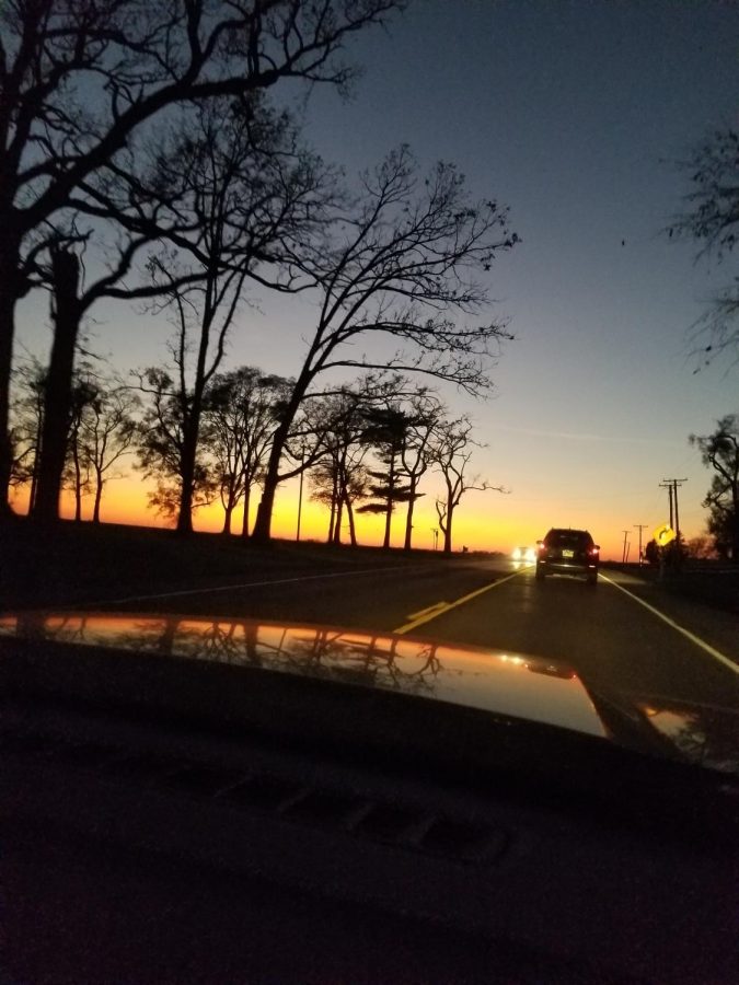 A clear sun sets on the horizon of winding, nearly empty roads in a rural side of Illinois. Peaceful and tranquil, a blanket of calm serves these uncertain times. While the sky may change in hue, it remains a constant, something small in nature to remain grateful for. - Eddie Burgin
