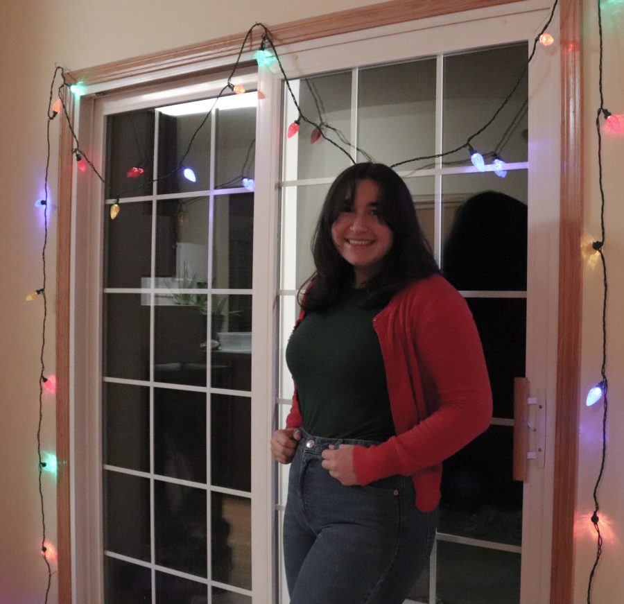 Editor-in-Chief Laine Cibulskis sports a dash of red and green for a bit of festivity as the holiday season continues into December. Though expressing joyfulness may not be as easy this year, humanity will draw forward; the roaring 20s hopefully approach. 