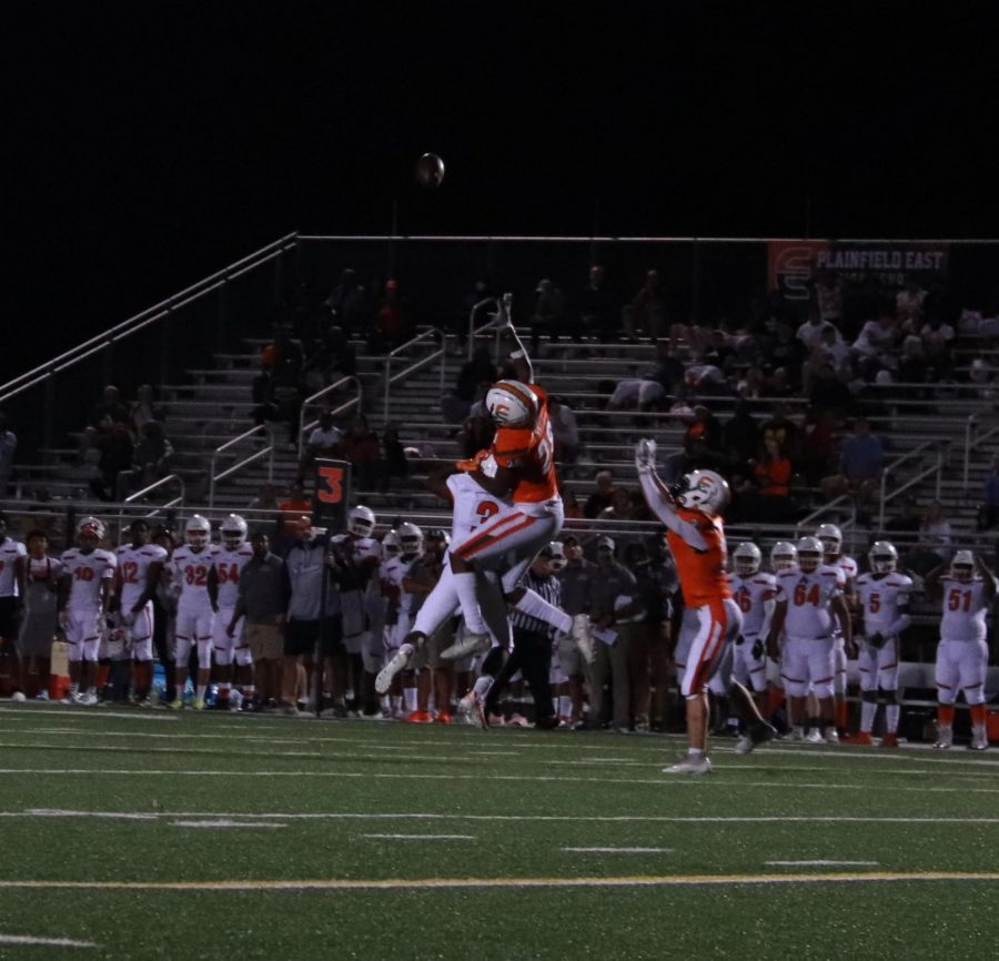 Sophomore Chidubem Bekee (defensive back, number 28) reaches to intercept the ball, air-bound and hands stretched to save the
play during the varsity game against Shepard High School on Sept.
3. Bengals won 32-21.
