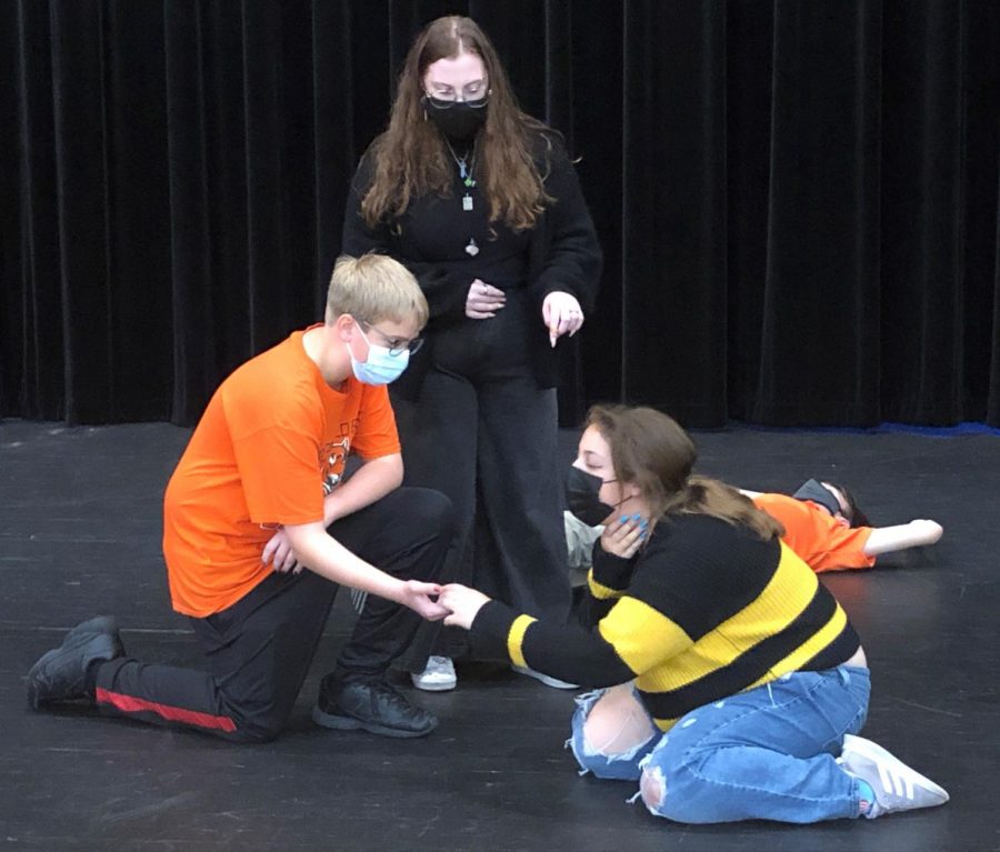 From left to right: Nathan Matzig, Deana Capua, Nora Dietz, and Dylan Guiliano act out a magical battle scene at an Oct. 15 rehearsal on the center stage.