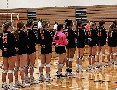 Plainfield East’s girls volleyball team pledges allegiance at a home
game against Yorkville on Oct. 19.