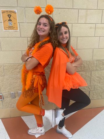 Marin Flynn and Brooke Emes show Bengal Pride with their orange out outfits.