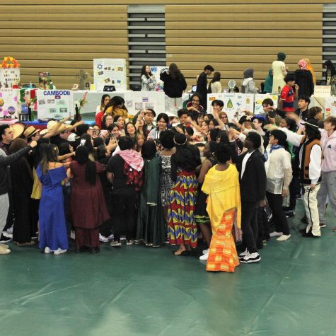 Participants of the multicultural fair gather for pep talk before final show.
