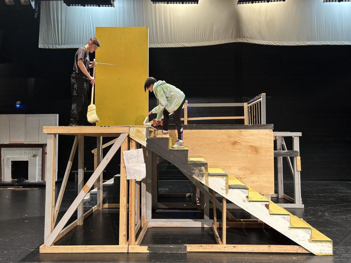 Tech students, Felix Tran and Jack, working on the set of Dracula in the auditorium on Oct 27 to prepare for the upcoming show.