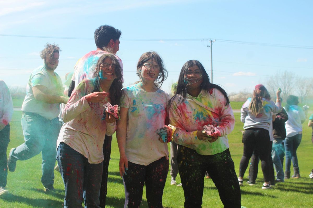 Students+throwing+color+to+celebrate+Plainfield+Easts+first+Holi+Festival+on+April+19.