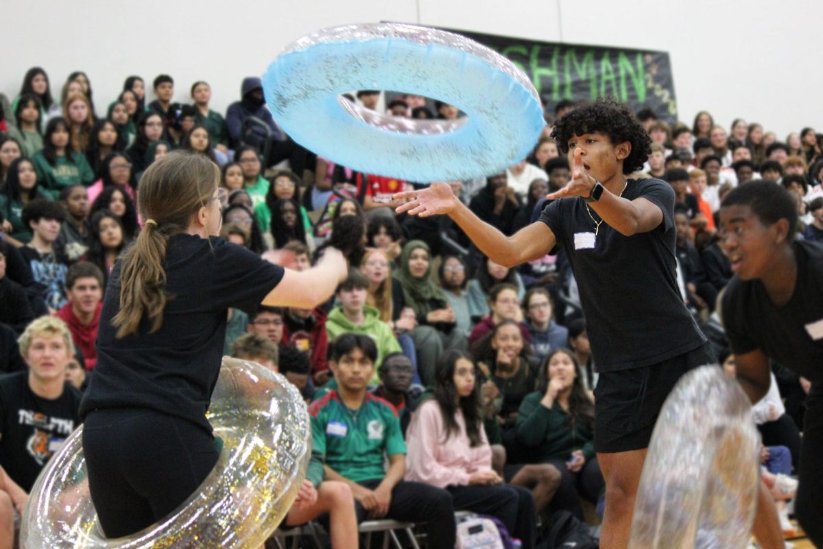 Freshmen team participating in new game, Tube Toss