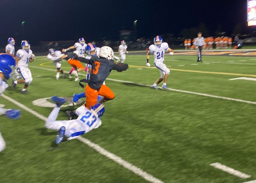 Jeremiah Jenkins breaks a tackle from Joliet Central #23 and runs for 13 yards late in the first half.